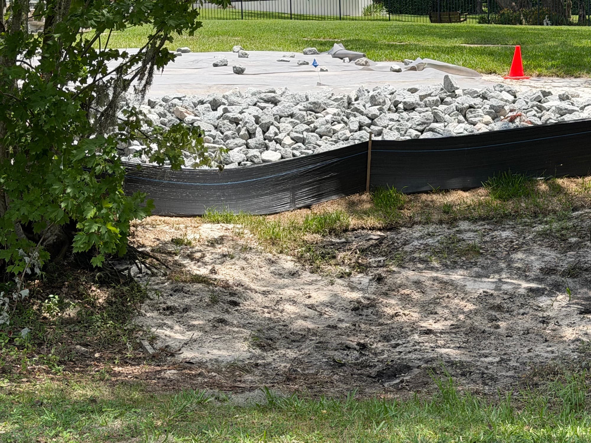 Riprap over geotextile with perimeter erosion control at a Central Florida site